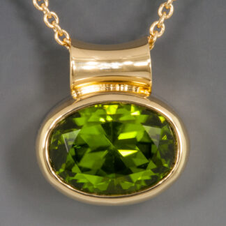 Oval Peridot Pendant with Flared Tube Bail