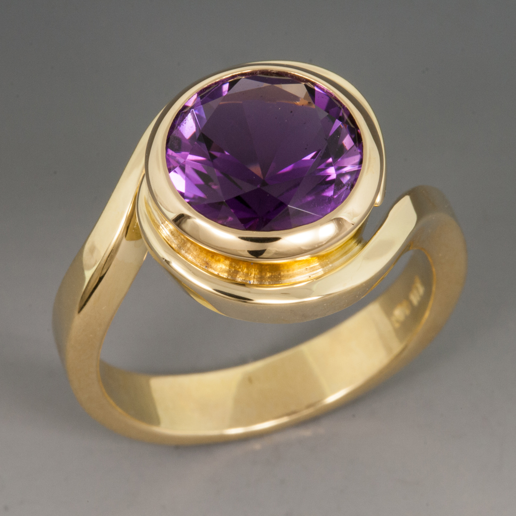 Round faceted Amethyst ring in prongs setting with 14k rose gold textu