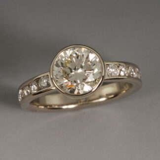 Ring, 8mm Center Diamond with 10 channel set diamonds, 14KW