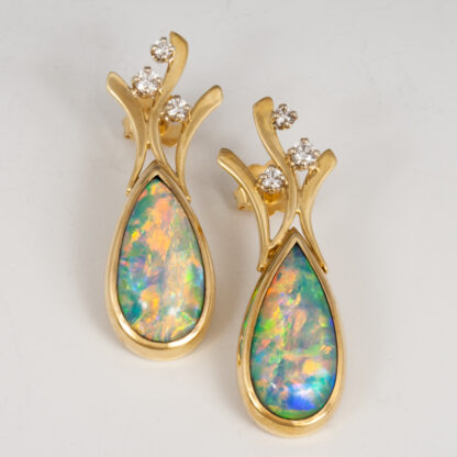 Earrings, Pear Shape Crystal Opals, 7.03ctw.(6) Diamonds, D-E VS, (2) .03 RBC 2.9mm .06ctw., (2) .02ct RBC 1.7mm .04ctw., (2) .05ct RBC 2.4mm .10ctw, Total diamond weight .20ctw,18KY, Laurie Donovan