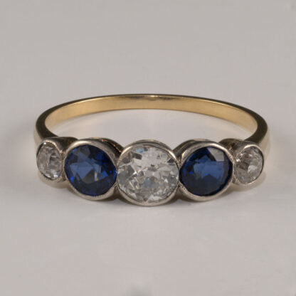 Ring, Diamond, Sapphire bezel set in platinum, 18KY shank, size 7.25, 1930's