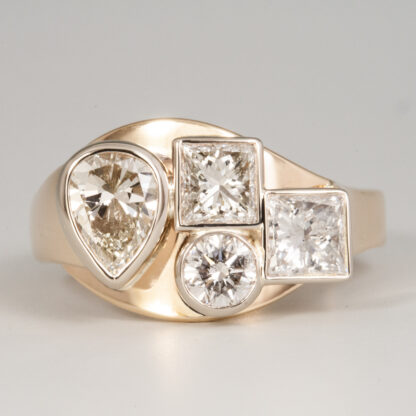 Ring, Diamonds provided, (1 Pear shape 5.15x6.96mm .65ct., 2 Princess cut 4.1mm .80ctw, 1 round 3.95mm .25ct) 14KY, size 6