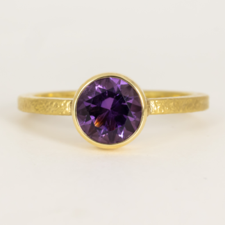 Amethyst on Textured Narrow Band Ring 18KY gold 1.65mm band ring by Rona Fisher  with Amethyst from Zambia 6.5mm .92ct set in textured bezel, 18KY size 6.75